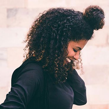 Garnier Fructis Curl Stretch Loosening Pudding - Curly Updo Hairstyle Gallery - Learn how to style Curly Half-Up Bun - simple, fun curly look